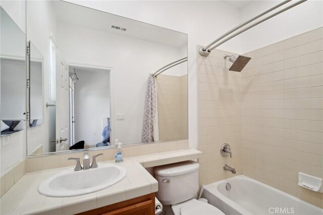 25422 Magnolia Ln, Stevenson Ranch, CA 91381 - bathroom featuring vanity, toilet, and shower / bath combo with shower curtain