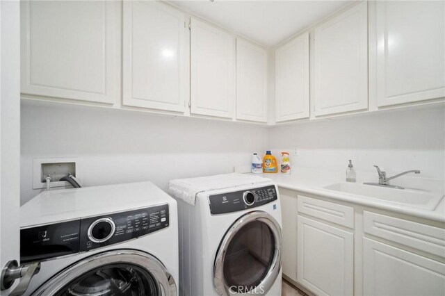 25422 Magnolia Ln, Stevenson Ranch, CA 91381 - washroom with washer and dryer and cabinet space