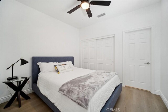 25422 Magnolia Ln, Stevenson Ranch, CA 91381 - bedroom with wood finished floors, a closet, baseboards, and a ceiling fan