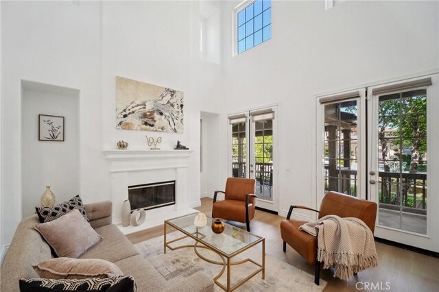 25422 Magnolia Ln, Stevenson Ranch, CA 91381 - living area with healthy amount of natural light, french doors, wood finished floors, and a high ceiling