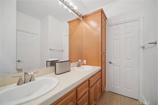25422 Magnolia Ln, Stevenson Ranch, CA 91381 - bathroom featuring double vanity and tile patterned flooring