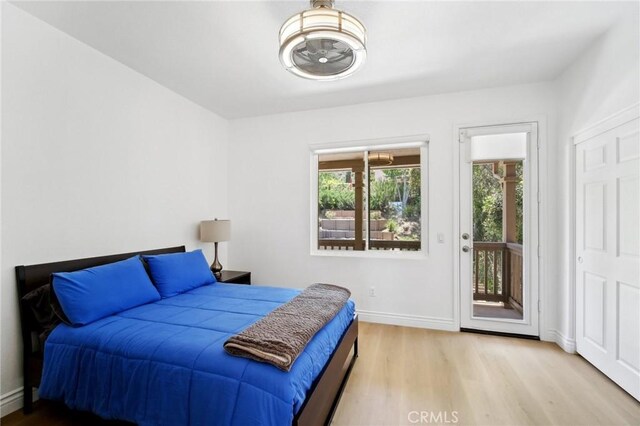 25422 Magnolia Ln, Stevenson Ranch, CA 91381 - bedroom featuring wood finished floors, access to outside, and baseboards