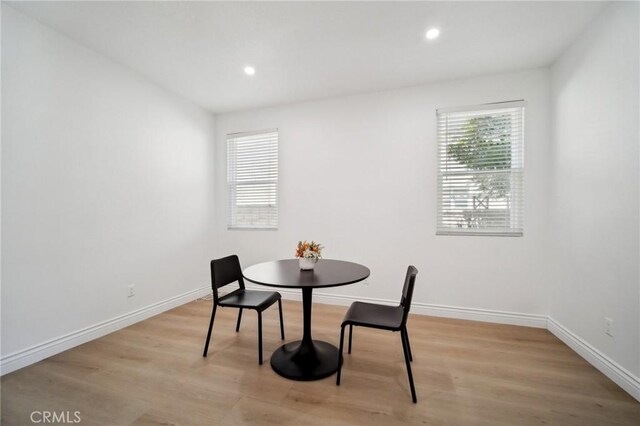 25422 Magnolia Ln, Stevenson Ranch, CA 91381 - dining room with light wood finished floors, baseboards, and recessed lighting