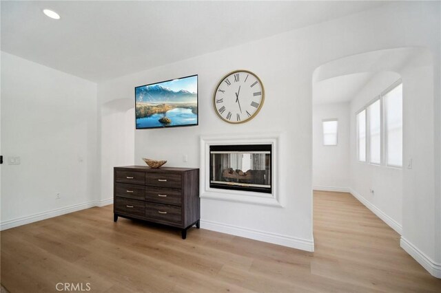 25422 Magnolia Ln, Stevenson Ranch, CA 91381 - living area with a multi sided fireplace, light wood-style floors, baseboards, and recessed lighting