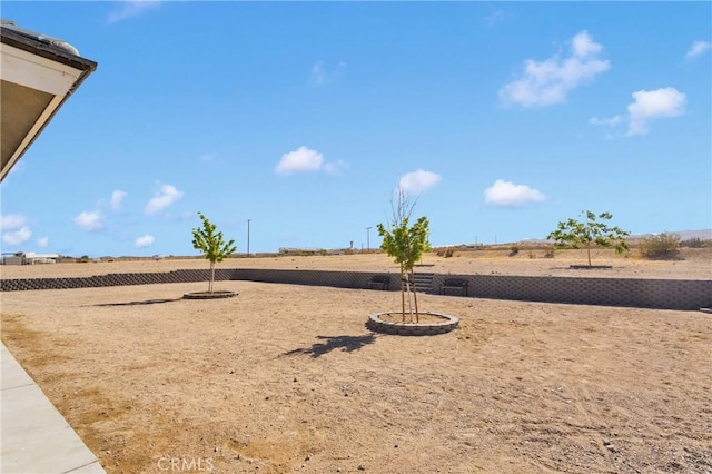 22489 Sweet Pea Rd, Oro Grande, CA 92368 - fenced backyard featuring a view of countryside