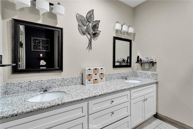22489 Sweet Pea Rd, Oro Grande, CA 92368 - full bathroom with double vanity, tile patterned flooring, and baseboards