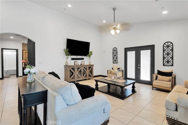 22489 Sweet Pea Rd, Oro Grande, CA 92368 - living room featuring arched walkways, light tile patterned flooring, a ceiling fan, recessed lighting, and french doors