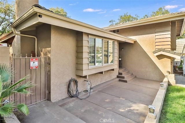 3738 Danmont Ct, Newbury Park, CA 91320 - doorway to property featuring stucco siding and a patio area