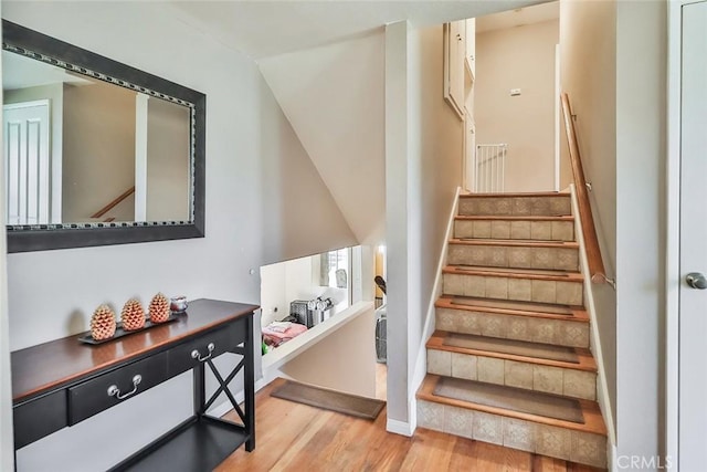 3738 Danmont Ct, Newbury Park, CA 91320 - stairway with wood finished floors, vaulted ceiling, and baseboards