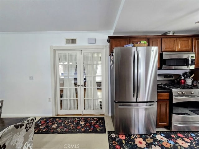 3738 Danmont Ct, Newbury Park, CA 91320 - kitchen featuring appliances with stainless steel finishes, ornamental molding, french doors, and brown cabinetry