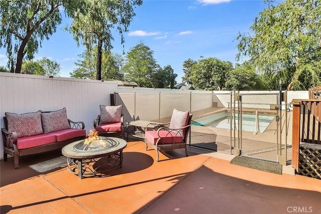 3738 Danmont Ct, Newbury Park, CA 91320 - fenced backyard with an outdoor living space with a fire pit and a patio area