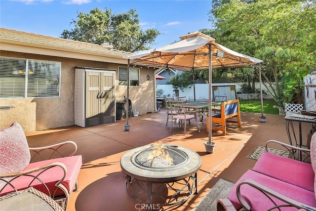 3738 Danmont Ct, Newbury Park, CA 91320 - fenced backyard featuring a fire pit, outdoor dining space, a patio, and a gazebo