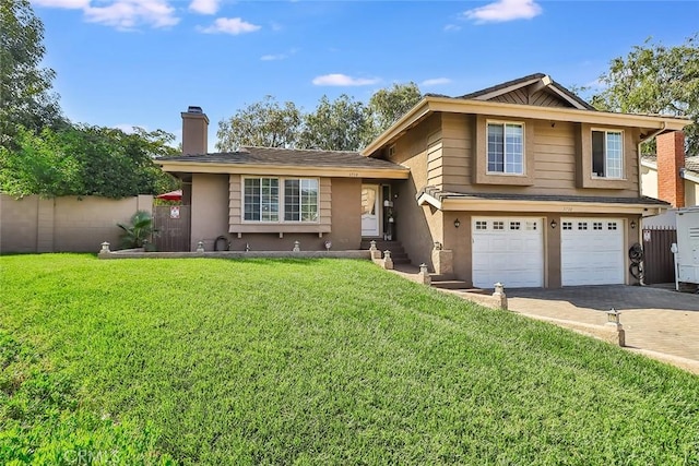 3738 Danmont Ct, Newbury Park, CA 91320 - tri-level home with driveway, a garage, a chimney, and stucco siding