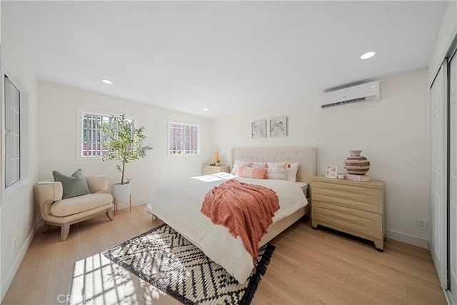3825 Welland Ave, Los Angeles, CA 90008 - bedroom with a wall unit AC, light wood-style flooring, baseboards, and recessed lighting
