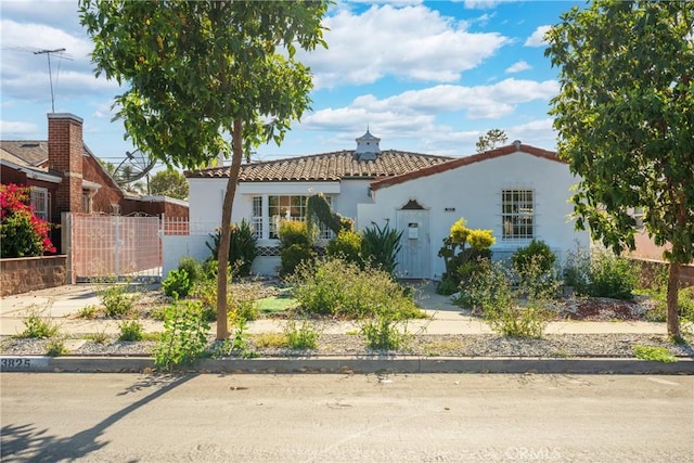 3825 Welland Ave, Los Angeles, CA 90008 - mediterranean / spanish home featuring stucco siding and a tiled roof