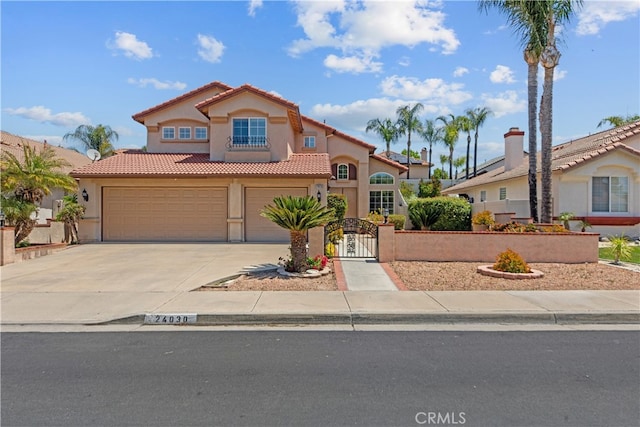 24030 Colmar Ln, Murrieta, CA 92562 - mediterranean / spanish-style house featuring a tiled roof, stucco siding, concrete driveway, and a gate