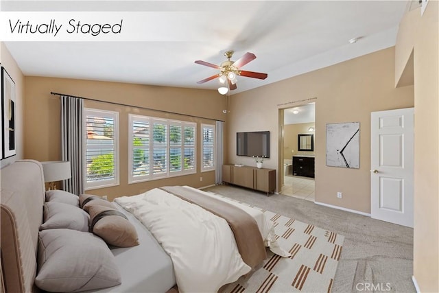 24030 Colmar Ln, Murrieta, CA 92562 - bedroom featuring light carpet, baseboards, ensuite bathroom, lofted ceiling, and a ceiling fan