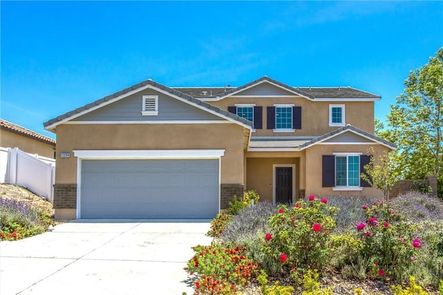11294 Chappell Way, Beaumont, CA 92223 - traditional-style home with stucco siding, concrete driveway, brick siding, and an attached garage