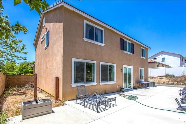 11294 Chappell Way, Beaumont, CA 92223 - back of property featuring stucco siding, a fenced backyard, and a patio area