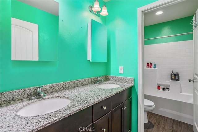 11294 Chappell Way, Beaumont, CA 92223 - bathroom with toilet, tub / shower combination, double vanity, wood finished floors, and recessed lighting