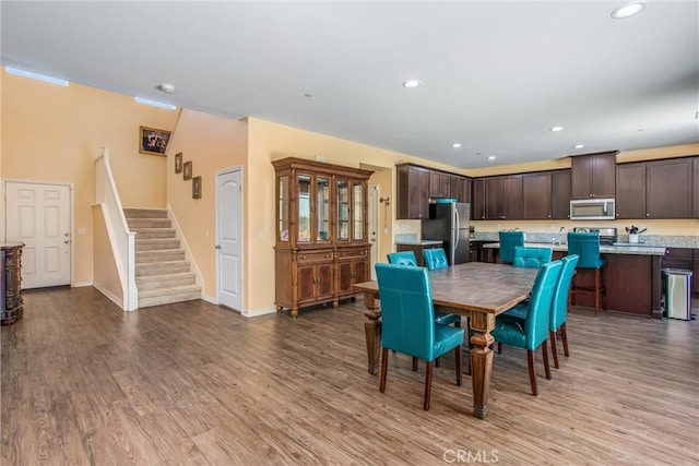 11294 Chappell Way, Beaumont, CA 92223 - dining area with wood finished floors, stairs, baseboards, and recessed lighting