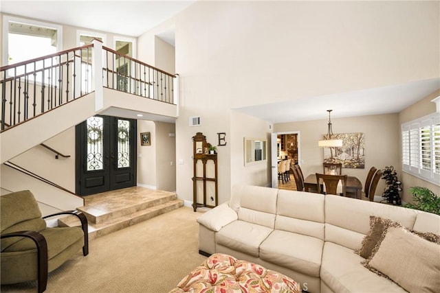 293 N Paseo De Juan, Anaheim Hills, CA 92807 - living room with carpet floors, a high ceiling, stairway, and baseboards