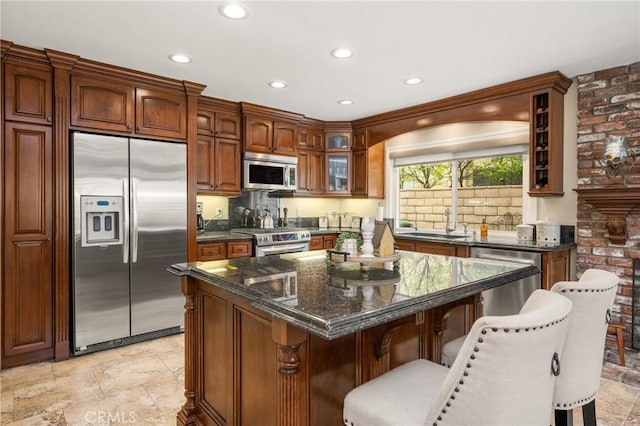 293 N Paseo De Juan, Anaheim Hills, CA 92807 - kitchen featuring stainless steel appliances, glass insert cabinets, a breakfast bar, recessed lighting, and a kitchen island