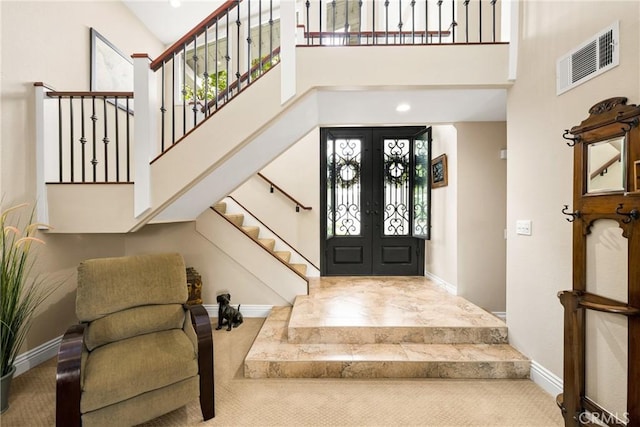 293 N Paseo De Juan, Anaheim Hills, CA 92807 - carpeted foyer entrance with a towering ceiling, french doors, stairway, baseboards, and healthy amount of natural light