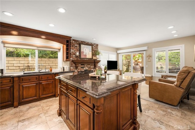 293 N Paseo De Juan, Anaheim Hills, CA 92807 - kitchen featuring open floor plan, a sink, a kitchen breakfast bar, a kitchen island, and dark stone counters