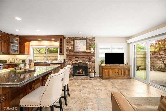 293 N Paseo De Juan, Anaheim Hills, CA 92807 - living room with healthy amount of natural light, a fireplace, and recessed lighting