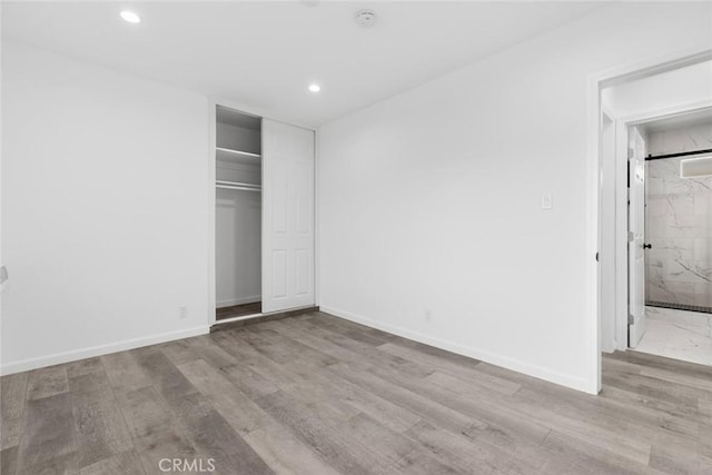 142 S Savannah St, Los Angeles, CA 90033 - unfurnished bedroom featuring recessed lighting, wood finished floors, a closet, and baseboards