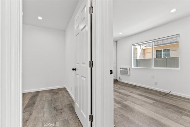 142 S Savannah St, Los Angeles, CA 90033 - hall featuring wood finished floors, a wall mounted air conditioner, baseboards, and recessed lighting
