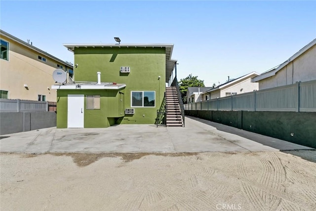 142 S Savannah St, Los Angeles, CA 90033 - back of property with stairs and stucco siding