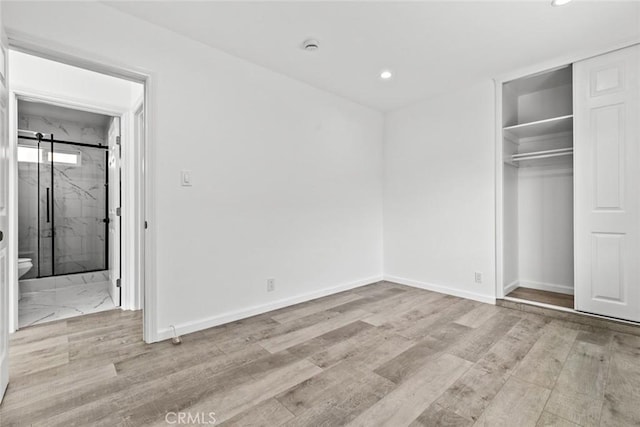 142 S Savannah St, Los Angeles, CA 90033 - unfurnished bedroom with recessed lighting, a closet, baseboards, wood finished floors, and connected bathroom