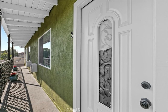 142 S Savannah St, Los Angeles, CA 90033 - doorway to property with stucco siding