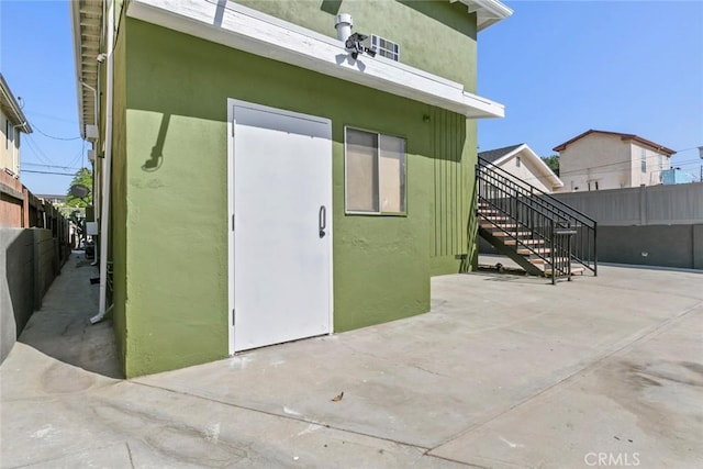 142 S Savannah St, Los Angeles, CA 90033 - doorway to property with a patio and stucco siding