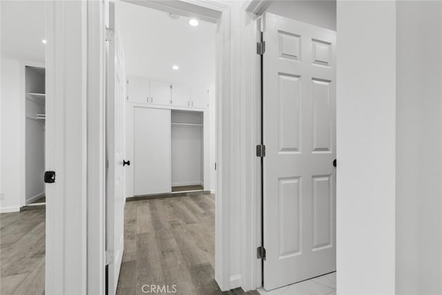 142 S Savannah St, Los Angeles, CA 90033 - hallway with light wood finished floors, baseboards, and recessed lighting