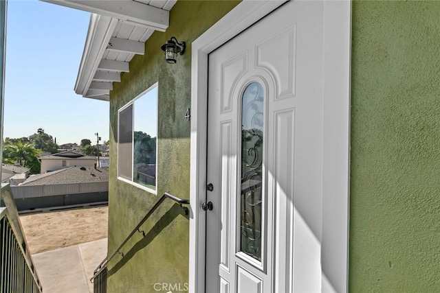 142 S Savannah St, Los Angeles, CA 90033 - doorway to property featuring stucco siding