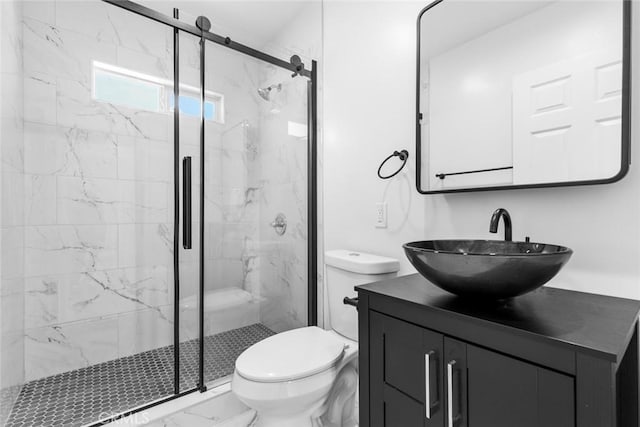 142 S Savannah St, Los Angeles, CA 90033 - bathroom with marble look tile flooring, toilet, a marble finish shower, and vanity