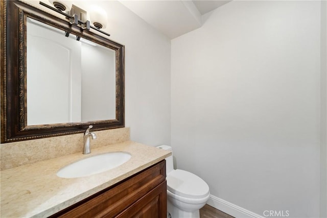 130 Alta St Unit B, Arcadia, CA 91006 - half bath featuring vanity, toilet, baseboards, and tasteful backsplash