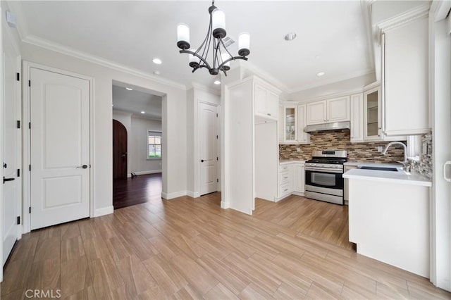 130 Alta St Unit B, Arcadia, CA 91006 - kitchen with stainless steel range with gas cooktop, a sink, a chandelier, light countertops, and under cabinet range hood