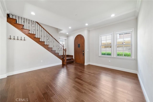 130 Alta St Unit B, Arcadia, CA 91006 - foyer featuring arched walkways, stairs, baseboards, wood finished floors, and crown molding