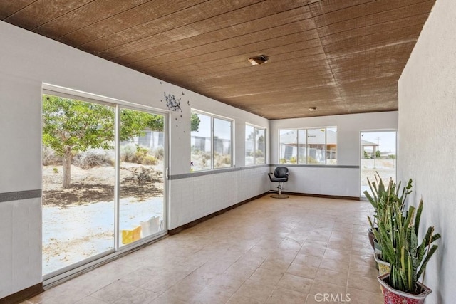 8636 Riggins Rd, Phelan, CA 92371 - unfurnished sunroom with wood ceiling and baseboards