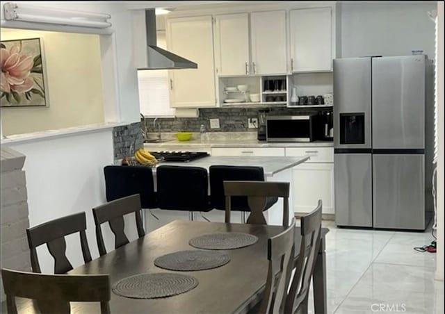 18763 Sunburst St, Northridge, CA 91324 - kitchen featuring appliances with stainless steel finishes, wall chimney exhaust hood, tasteful backsplash, light countertops, and a sink
