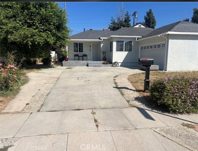 18763 Sunburst St, Northridge, CA 91324 - ranch-style home featuring driveway and an attached garage