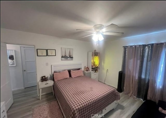 18763 Sunburst St, Northridge, CA 91324 - bedroom featuring light wood-type flooring, a ceiling fan, and baseboards