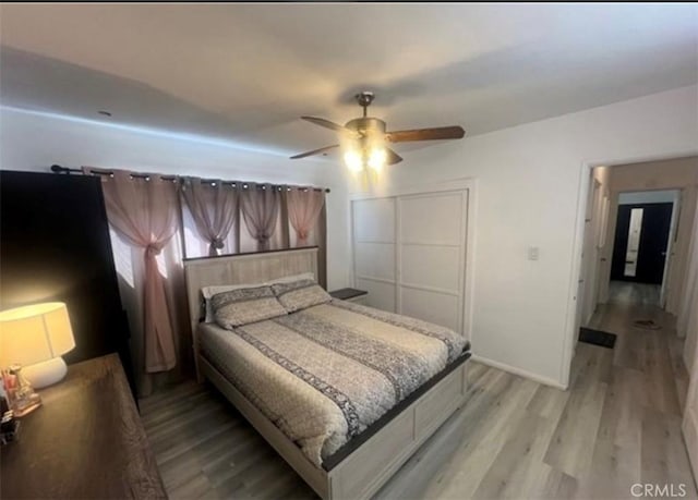18763 Sunburst St, Northridge, CA 91324 - bedroom with light wood-style floors, a closet, ceiling fan, and baseboards