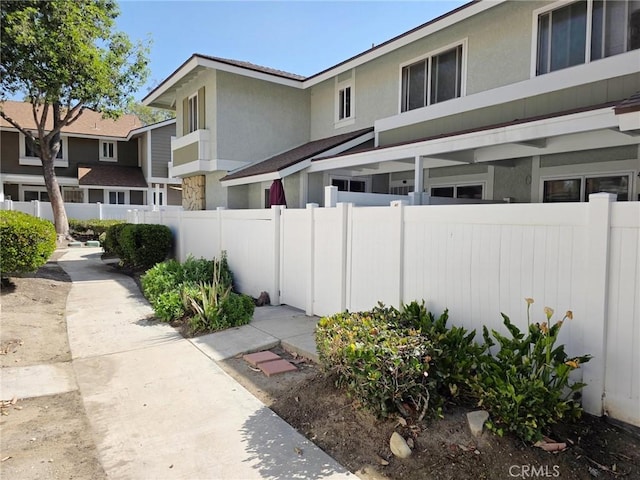1650 S Campus Ave Unit 41, Ontario, CA 91761 - view of side of property featuring stucco siding