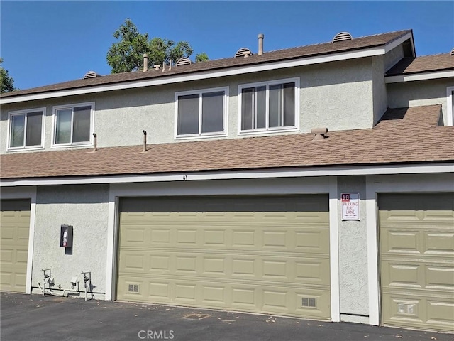 1650 S Campus Ave Unit 41, Ontario, CA 91761 - rear view of house with stucco siding and roof with shingles