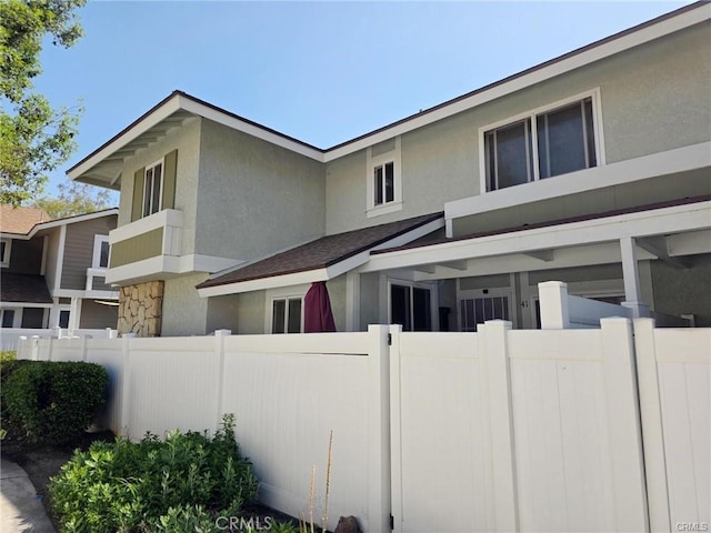 1650 S Campus Ave Unit 41, Ontario, CA 91761 - view of property exterior featuring stucco siding and stone siding